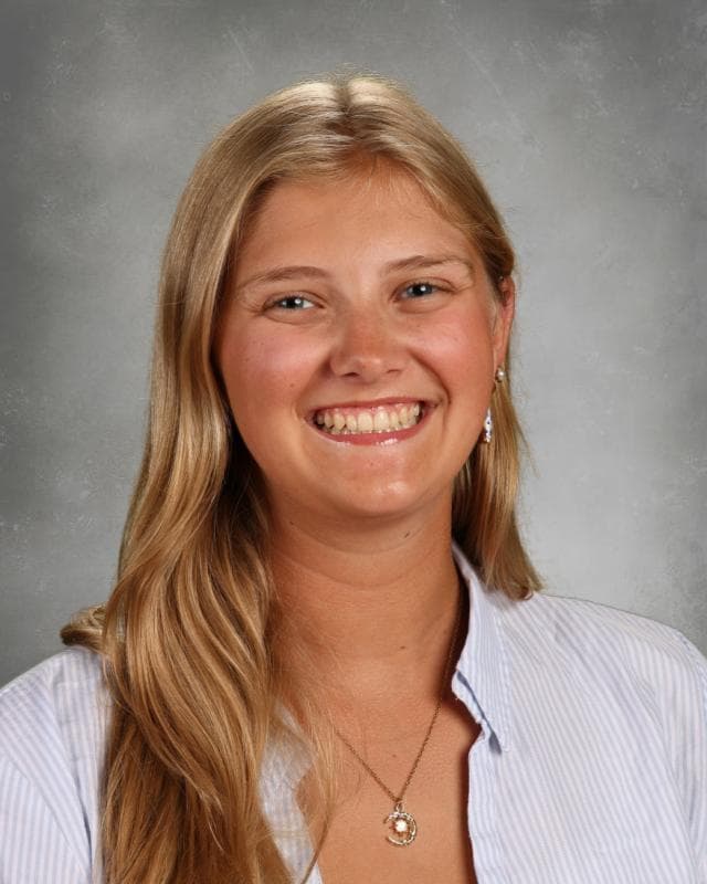 Portrait of Alexa Tapprich wearing a blazer and looking confident